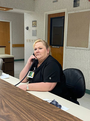 Picture of a female Nurse on the phone in our Case Management Department