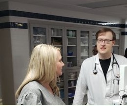 Picture of a male Physician talking to a female in the Emergency Department